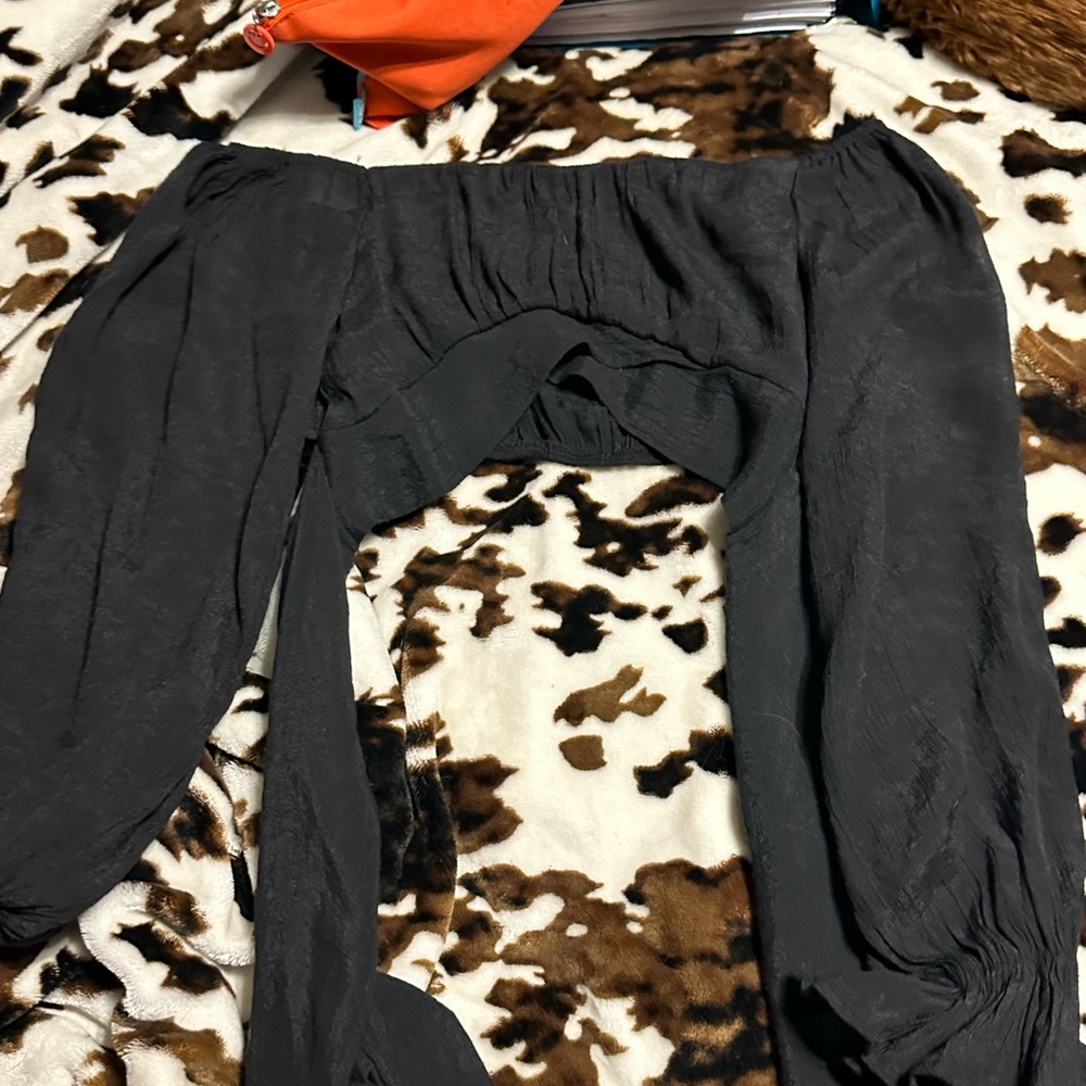 Long sleeve black crop top. Ties in back